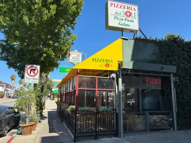 Pizzeria Del Sol yellow awning and street sign on Ventura Boulevard